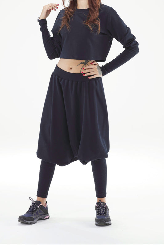 Woman wearing a black outfit on a white background