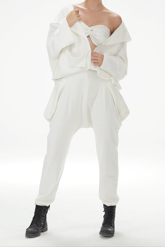Person wearing a white outfit with a plain background