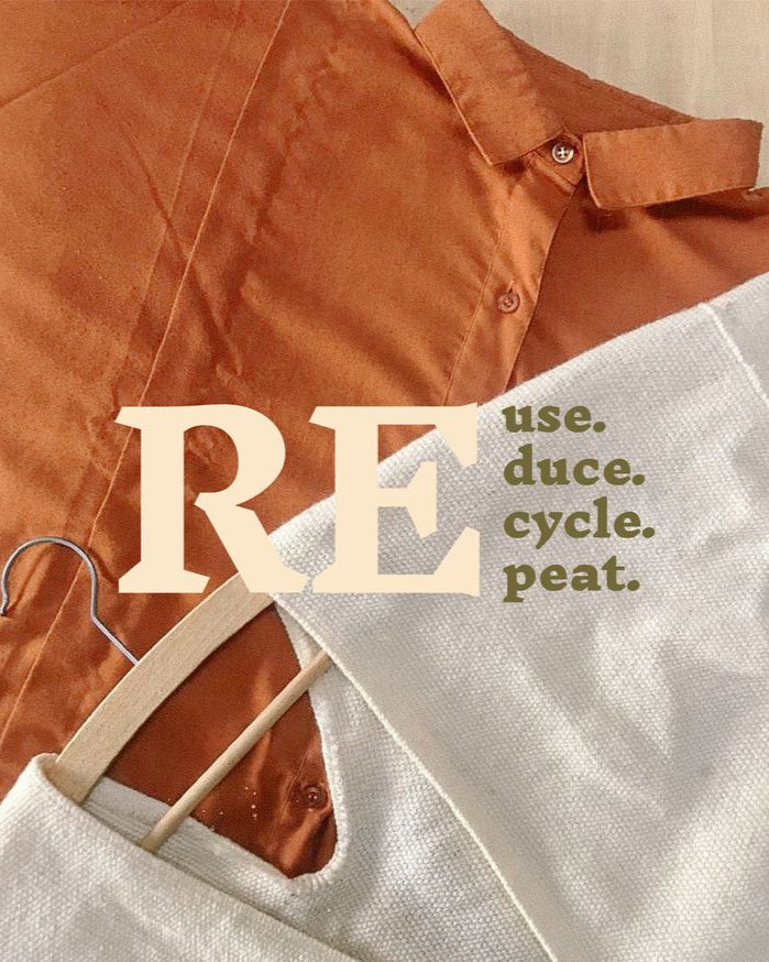 Brown shirt and white apron on hangers with 'RE use. duce. cycle. peat.' text.